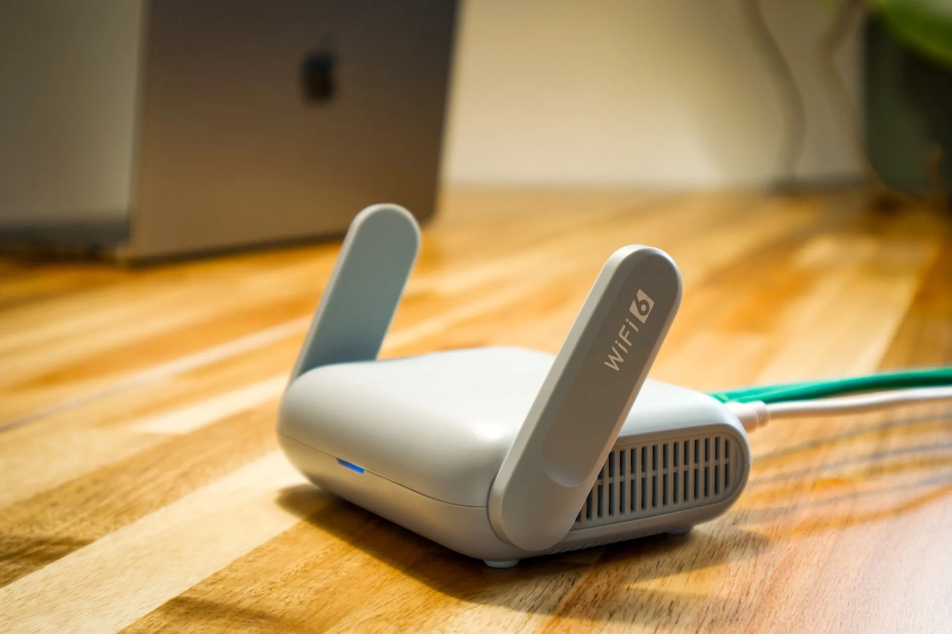 Wifi router on a wooden desk.