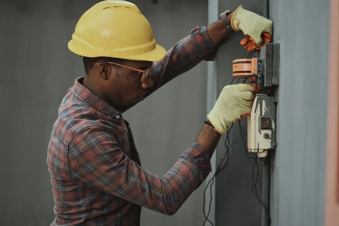 Engineer installing network cable
