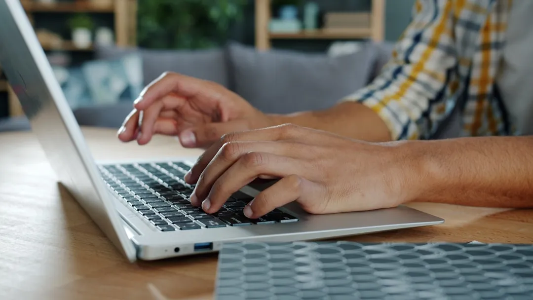 Person signing up on laptop