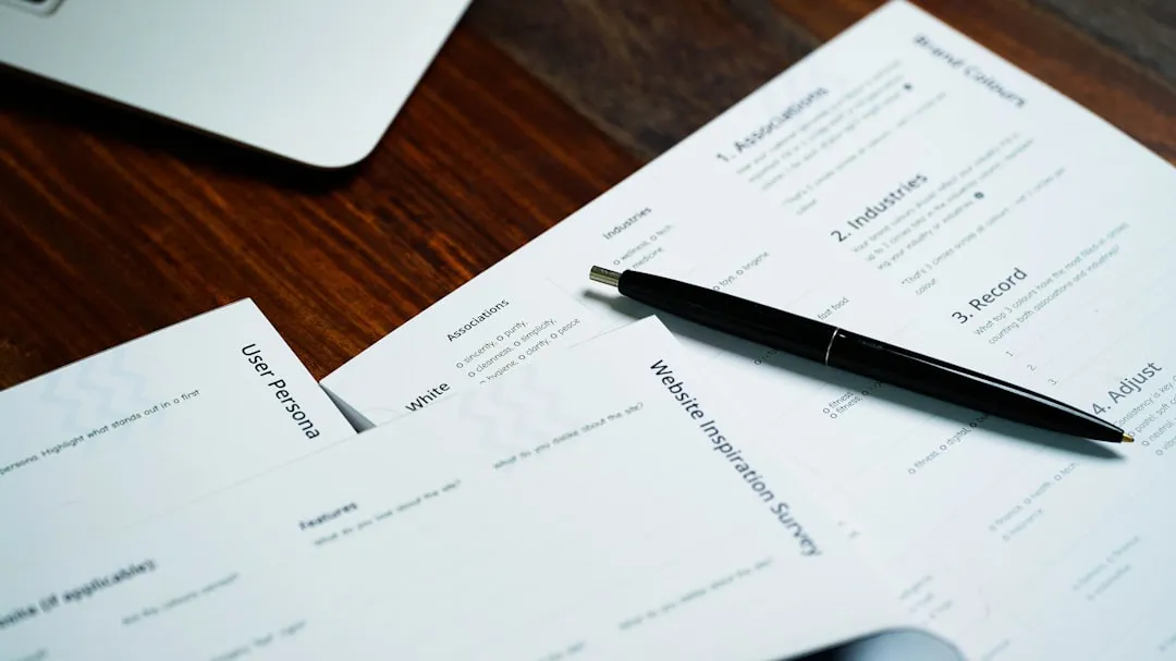 Pen resting on contract paperwork