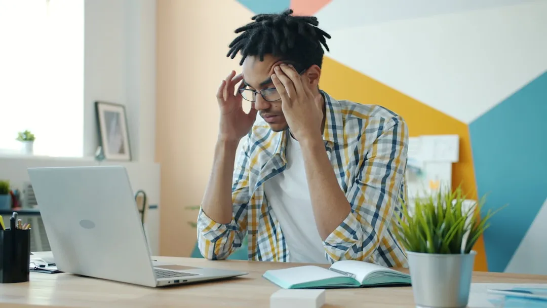Frustrated man at laptop