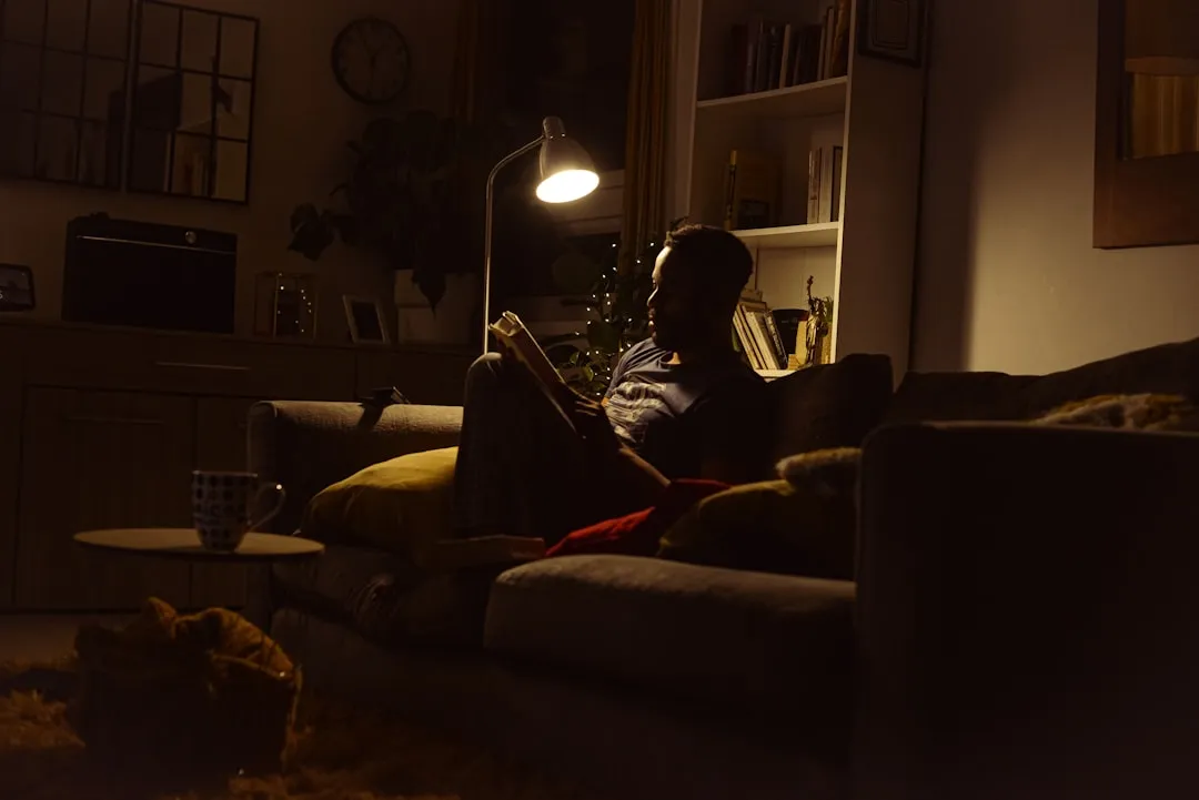 Person on sofa at night.