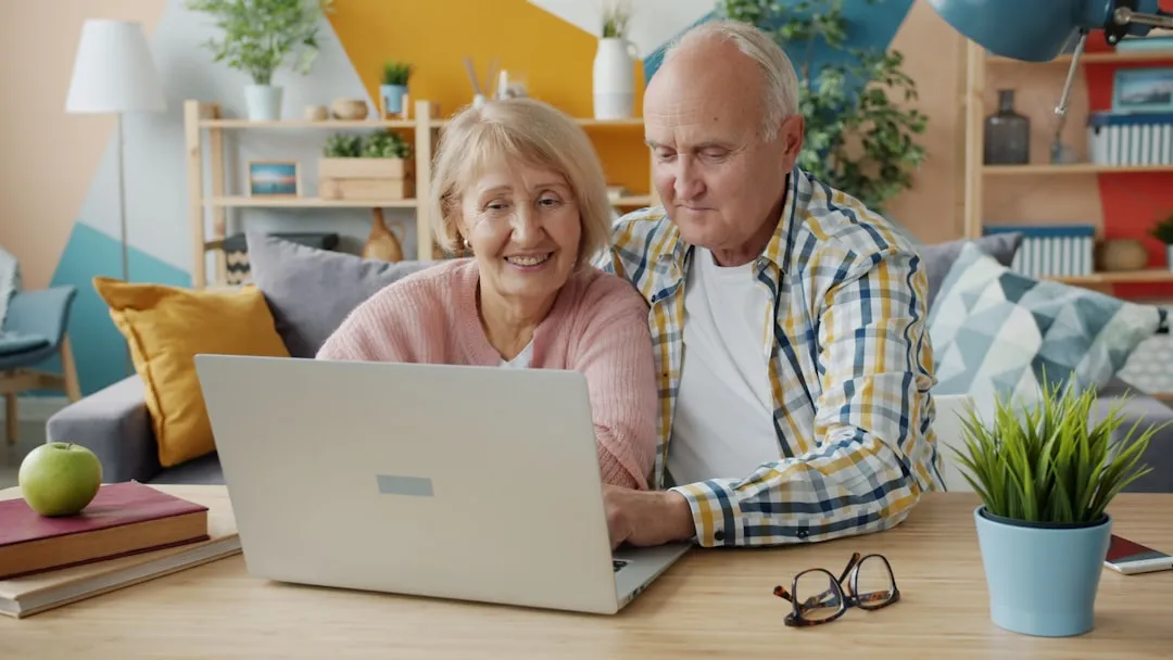 Older couple using a laptop