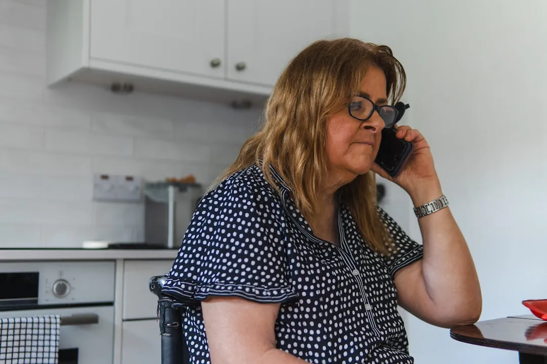 Woman on phone in kitchen