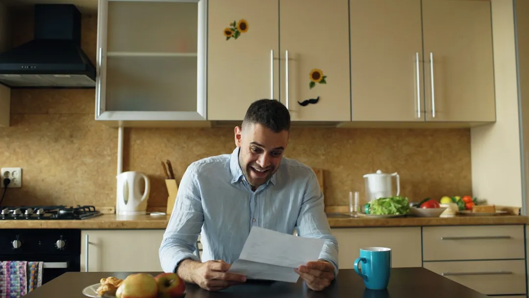 Man reading letter at home