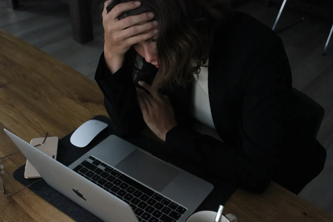 Frustrated woman at a laptop